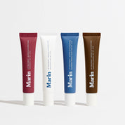 4 different flavored Lip products photographed on white background