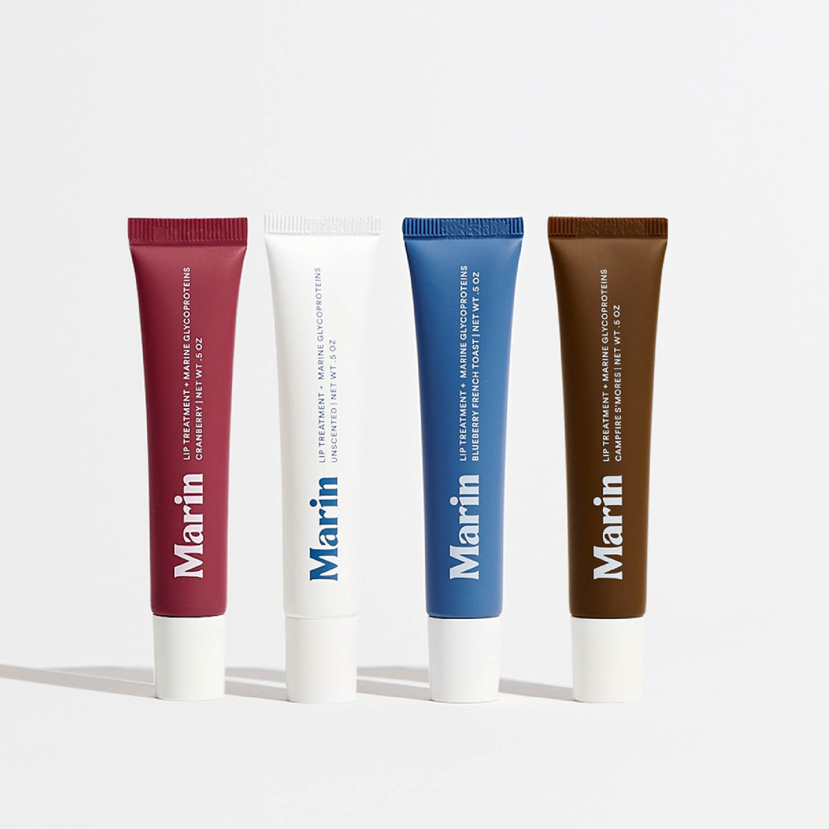 4 different flavored Lip products photographed on white background