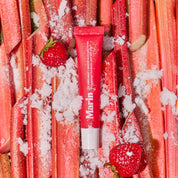 Marin Lip Treatment tube on sugared Rhubarb stalks with Strawberry halves