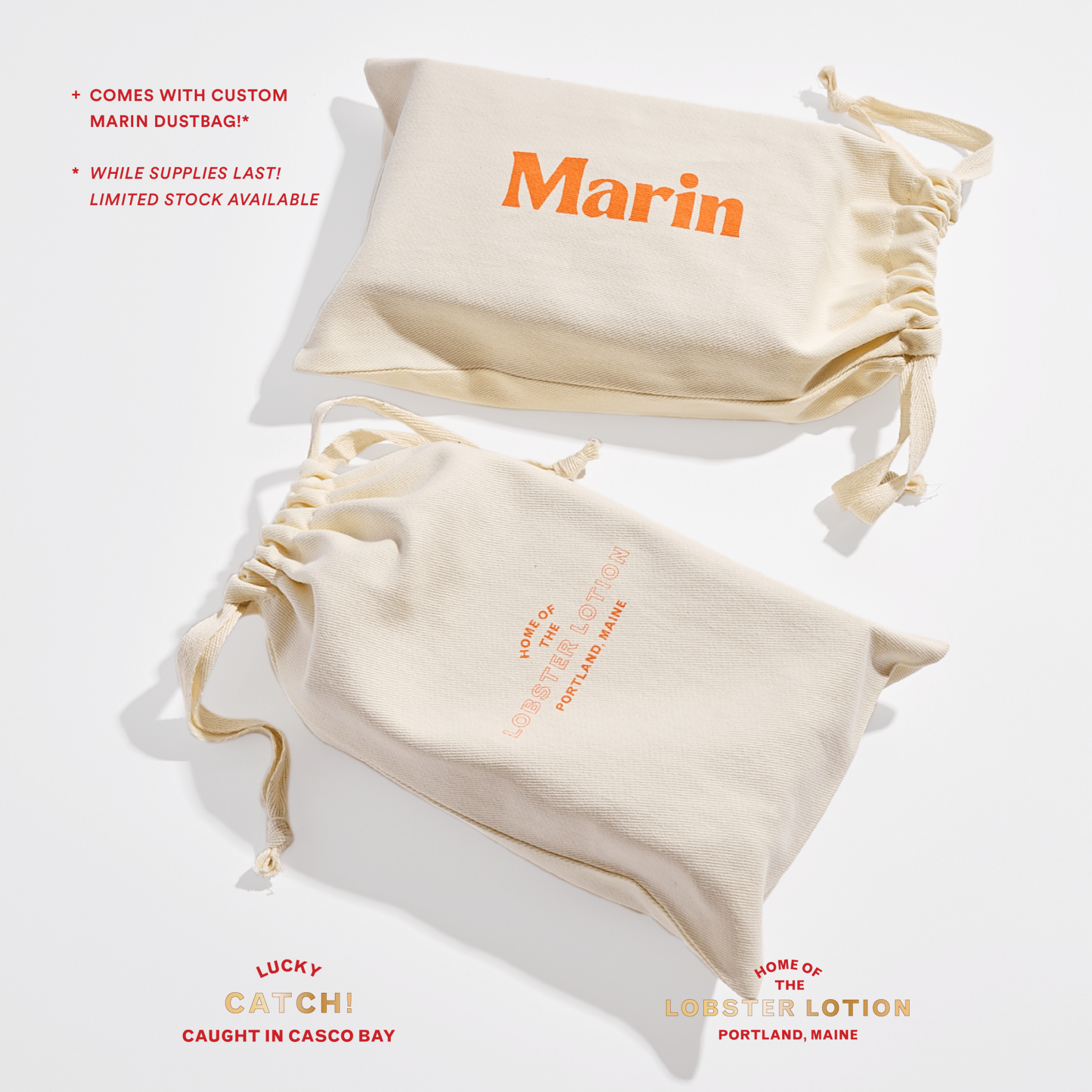 Cream canvas drawstring dust bags with orange Marin logo and small Lobster Lotion, Portland Maine text